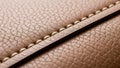 Close-up of a brown leather surface showcasing detailed stitching Royalty Free Stock Photo