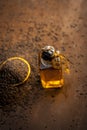 Close up of brown mustard seed,with its extracted oil on a brown wooden surface in dark Gothic colors.Its oil Boosts Cardiac Healt Royalty Free Stock Photo