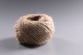 Brown rope roll, skein of jute twine on grey background Royalty Free Stock Photo