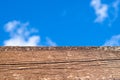 Close-up of brown wood against sky