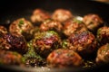 Homemade Meatballs Frying in a Pan with Fresh Herbs Royalty Free Stock Photo