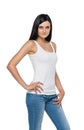 Close up of brunette girl in denims and white tank top. Royalty Free Stock Photo