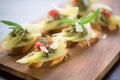 close-up of bruschettas with artichoke and parmesan