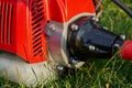 close-up of the brush cutter on the grass,new trimmer for the gardener, tools for the garden