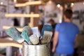 Close Up Of Brushes In Workshop Of Couple Upcycling Furniture