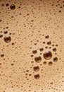 A close-up of a bubbly foam surface, with numerous small and large bubbles. The Royalty Free Stock Photo