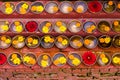 Close-up on Buddhist flower offerings in bowls.