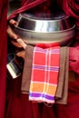 Close up of buddhist monk hands holding a bowl and cup Royalty Free Stock Photo
