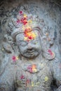 Close up buddhist statue Kathmandu Nepal. Close up of oblations of food and flowers to their gods on small statues , Kathmandu Royalty Free Stock Photo