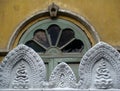 Close-up of a Buddhist temple`s broken window