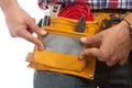 Close-up of builder fixing pocket with ducktape Royalty Free Stock Photo