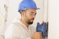 close up builder working with grinding tool Royalty Free Stock Photo