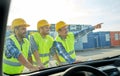 Close up of builders with blueprint on car hood Royalty Free Stock Photo