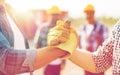 Close up of builders hands making handshake Royalty Free Stock Photo