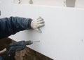 Building contractor insulating House Wall with styrofoam insulation sheets