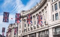 Close up of building on Regent Street London with row of British flags to celebrate the wedding of Prince Harry to Meghan Markle