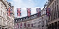 Close up of buildings on Regent Street London with row of British flags to celebrate the wedding of Prince Harry to Meghan Markle