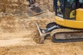 Close up of bulldozer scoop moving earth for foundation building construction site