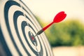 Close-up the bullseye or bulls eye target or dart board has dart arrow throw hitting the center Royalty Free Stock Photo