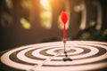 Close-up the bullseye or bulls eye target or dart board has dart arrow throw hitting the center Royalty Free Stock Photo