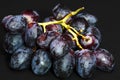 Close up of a bunch of black grapes Royalty Free Stock Photo