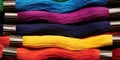 A close up of a bunch of different colored threads