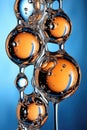 A close up of a bunch of orange and blue bubbles, AI