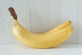 Close up bunch of ripe banans lying on white wooden table Royalty Free Stock Photo