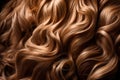 Close-up of a bunch of shiny curls of blond hair.