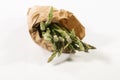 Close up of a bunch of wild asparagus in a paper bag. Fresh and vegan food concept Royalty Free Stock Photo