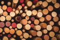 a close up of a bunch of wine corks with a red dot in the middle of the cork