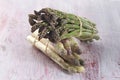 Close up of bunch of young green and white asparagus