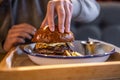 Close-up burger with egg and meat in a plate with sauce Royalty Free Stock Photo