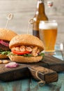 Close up burger with grilled prawns and glass light beer Royalty Free Stock Photo