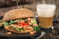 Close up burger with grilled shrimp and light beer Royalty Free Stock Photo