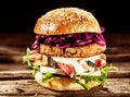 Close Up of Burger Piled High with Fresh Toppings