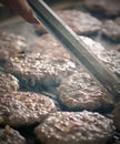 Close up of burgers on a barbeque Royalty Free Stock Photo