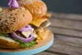 Close up burgers on cutting board Royalty Free Stock Photo