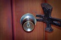 Close up of a burglar holding a crowbar to open a housedoor