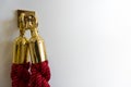 Close up of burgundy red noble lock chain cord with golden ends hooked on a hook against white background with copy space as