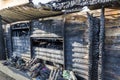 Close up Burned damaged ruins of destroyed supermarket metallic facade arson investigation insurance