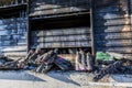 Close up Burned damaged ruins of destroyed supermarket metallic facade arson investigation insurance