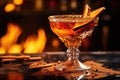 close-up of burning cinnamon in flaming cocktail