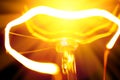 Close-up of burning light bulb with tungsten filament in center Royalty Free Stock Photo