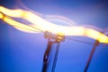 Close-up of burning light bulb with tungsten filament in center Royalty Free Stock Photo