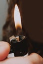 Close up of a burning lighter in hand Royalty Free Stock Photo