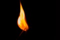 Close-up of a burning matchstick on a black background Royalty Free Stock Photo