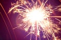 Burning sparkler firework with lots of hot glowing embers exploding. For New Years or 4th of July celebration Royalty Free Stock Photo