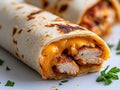 A close up of a burrito cut in half on a plate Royalty Free Stock Photo