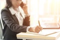 Close up of Business African American Woman Working sitting at her Desk Royalty Free Stock Photo